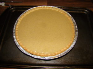 preparing pumpkin pie image